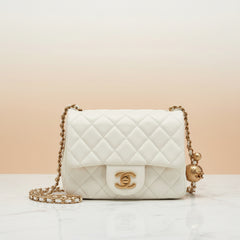 Chanel Pearl Crush mini square flap bag in quilted lambskin with CC turnlock, pearl charm and chain strap