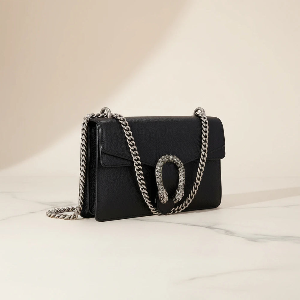 Gucci Dionysus small shoulder bag in black leather with antique silver tiger head closure, front view