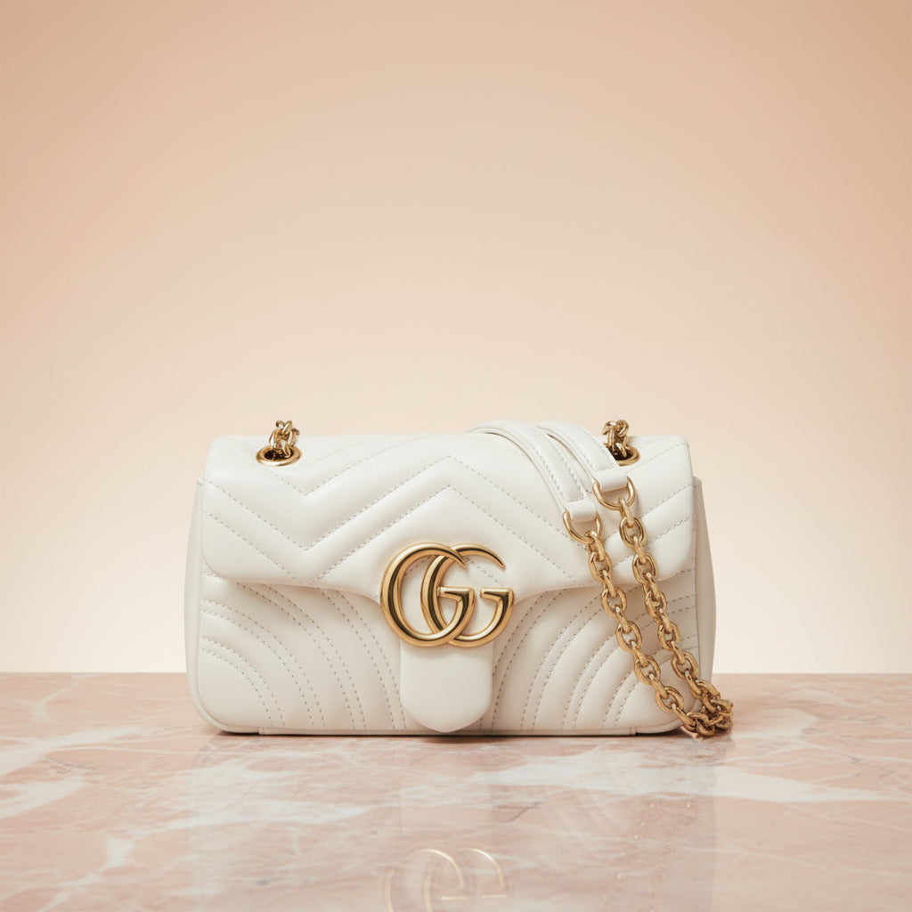 Gucci GG Marmont small shoulder bag in quilted matelassé leather with antique gold Double G, front view