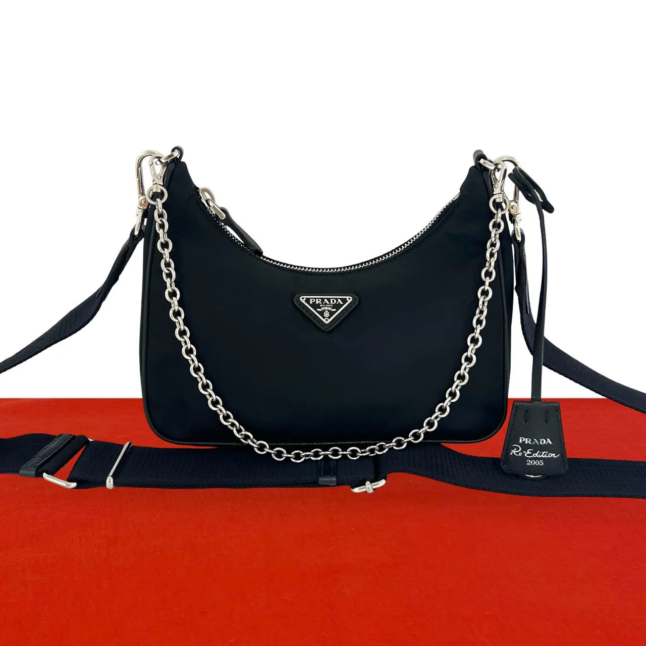 Prada Re-Edition 2005 Re-Nylon shoulder bag with chain strap, enamel triangle logo and detachable mini pouch